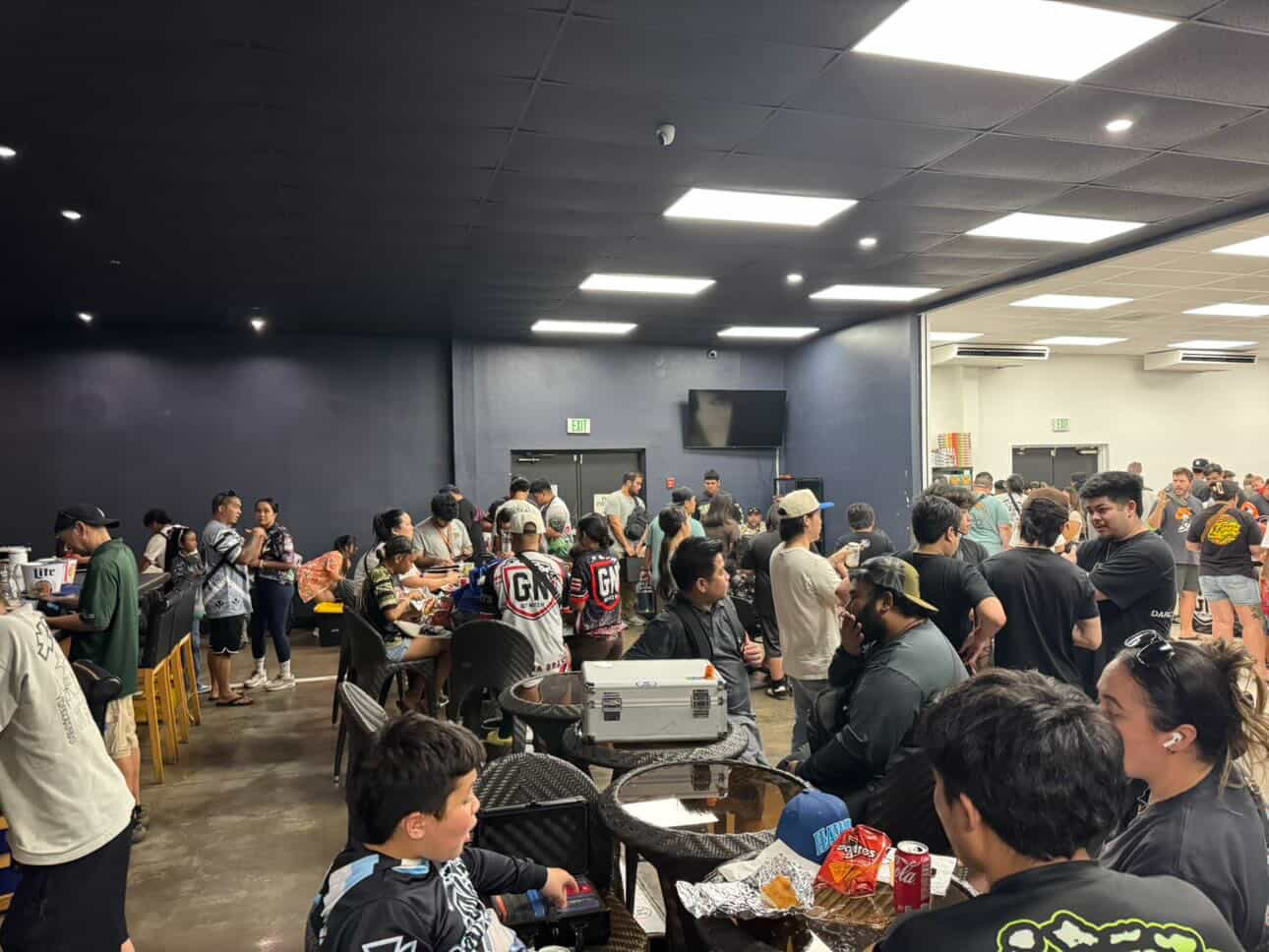 GetNutz x Paradise Show — seating area with collectors in GetNutz jerseys eating and talking