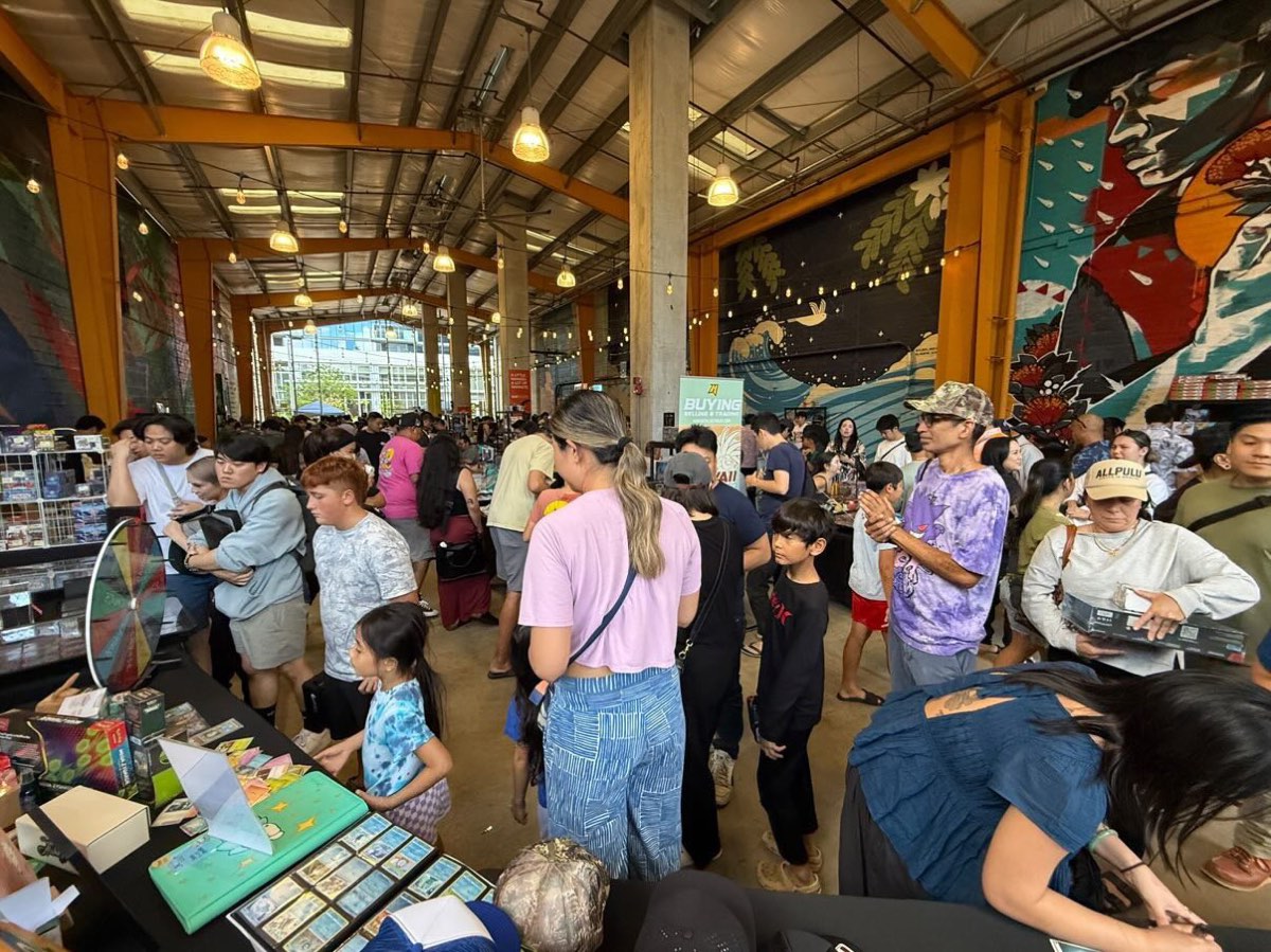 Packed floor at Keep It Aloha #2 — collectors, families, and murals under the SALT Kaka'ako warehouse roof