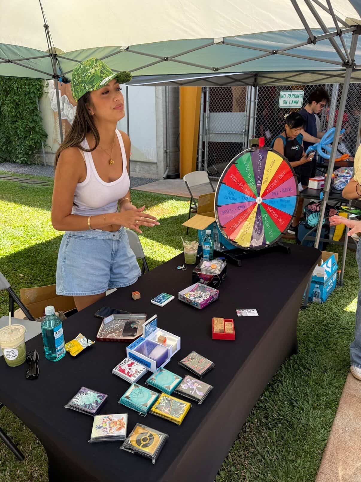 Keep It Aloha Card Show — vendor running a Pokemon-themed prize wheel with mystery pulls and prizes at their booth